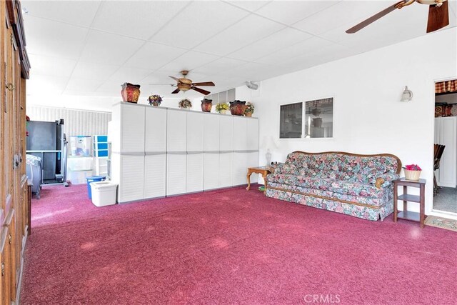 15199 Farmington Ct, Hesperia, CA 92345 - carpeted living area with ceiling fan and a drop ceiling