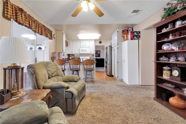 15199 Farmington Ct, Hesperia, CA 92345 - living area featuring light carpet, ceiling fan, and a textured ceiling