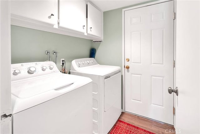 15199 Farmington Ct, Hesperia, CA 92345 - washroom featuring cabinet space, washing machine and dryer, and light wood-style flooring