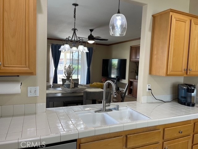 124 Lighthouse Ct, San Jacinto, CA 92583 - kitchen with a sink, open floor plan, ceiling fan, light countertops, and crown molding