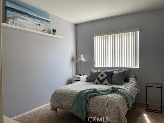 124 Lighthouse Ct, San Jacinto, CA 92583 - carpeted bedroom with baseboards