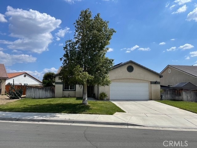 124 Lighthouse Ct, San Jacinto, CA 92583 - obstructed view of property featuring an attached garage, concrete driveway, and stucco siding