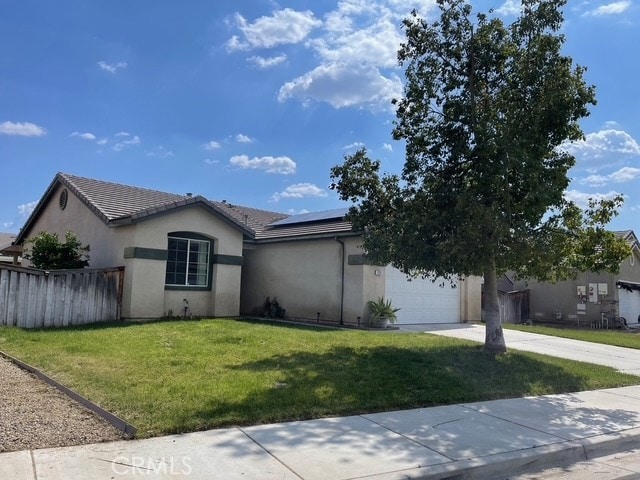 124 Lighthouse Ct, San Jacinto, CA 92583 - single story home with a garage, roof mounted solar panels, driveway, stucco siding, and a tiled roof
