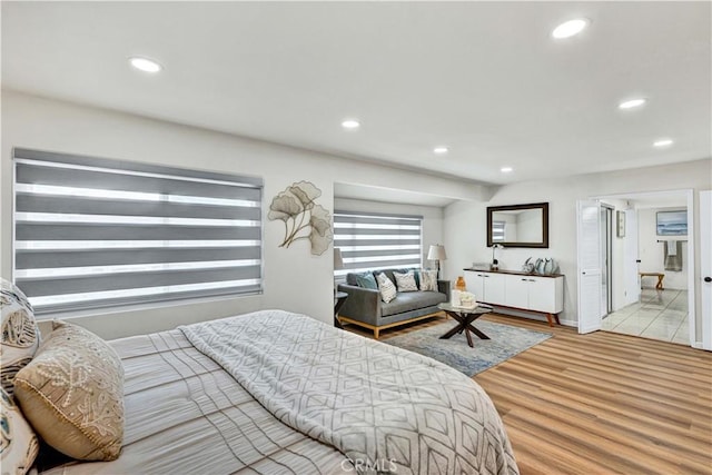 bedroom featuring recessed lighting and light wood-style floors