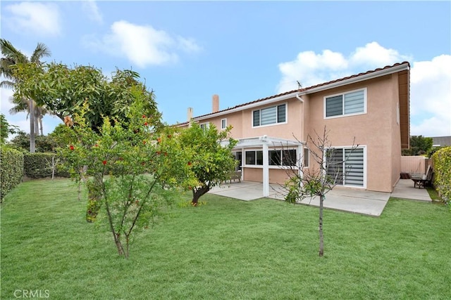 back of property with stucco siding, a pergola, a patio, and a tiled roof