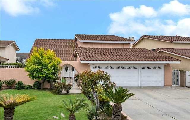 mediterranean / spanish-style house featuring a garage, a tiled roof, concrete driveway, and stucco siding