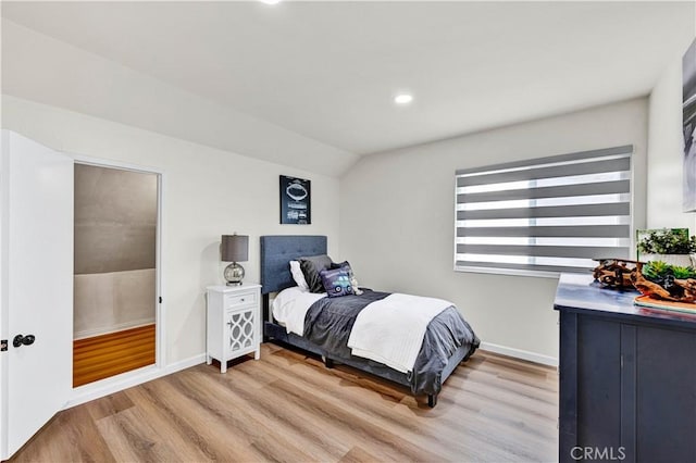 bedroom featuring vaulted ceiling, light wood-style flooring, recessed lighting, and baseboards