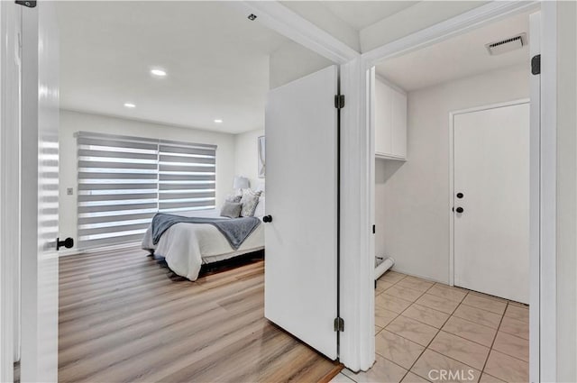 bedroom featuring recessed lighting