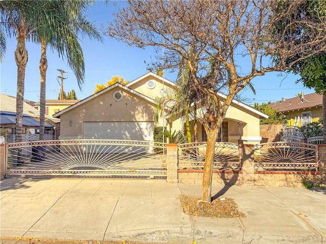 823 E 3rd St, Pomona, CA 91766 - ranch-style home featuring stucco siding, an attached garage, and concrete driveway