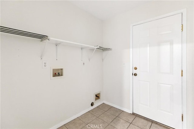 823 E 3rd St, Pomona, CA 91766 - laundry area featuring light tile patterned floors, washer hookup, and baseboards