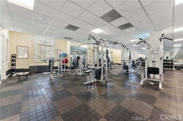 gym featuring a drop ceiling