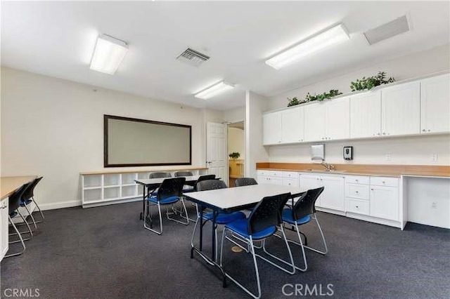 8160 W Preserve, Chino, CA 91708 - interior space featuring dark colored carpet, baseboards, and a sink