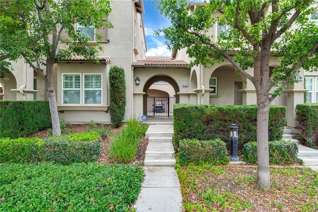 8160 W Preserve, Chino, CA 91708 - view of front facade featuring stucco siding, a tiled roof, and a gate