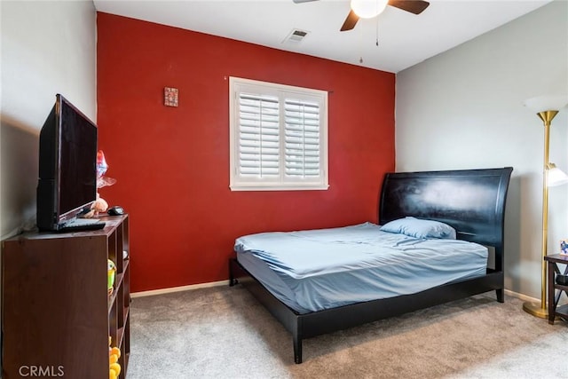 bedroom with carpet, baseboards, and ceiling fan