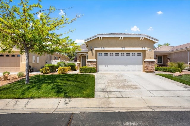 19536 Cherrydale Ct, Apple Valley, CA 92308 - view of front of house featuring stucco siding, stone siding, an attached garage, and a front lawn