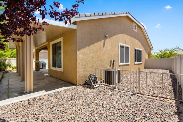 19536 Cherrydale Ct, Apple Valley, CA 92308 - back of property featuring a patio, a fenced backyard, and stucco siding