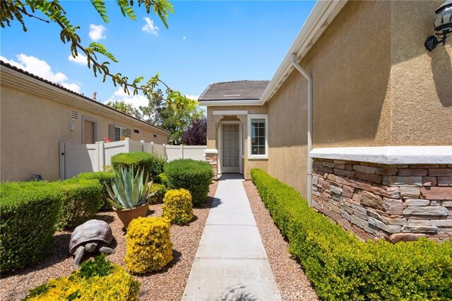 19536 Cherrydale Ct, Apple Valley, CA 92308 - doorway to property with fence and stucco siding