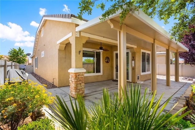 19536 Cherrydale Ct, Apple Valley, CA 92308 - back of property featuring ceiling fan, a patio area, stucco siding, and a fenced backyard