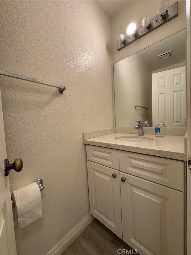 2801 Woodview Ct, Walnut, CA 91789 - bathroom with vanity and wood finished floors