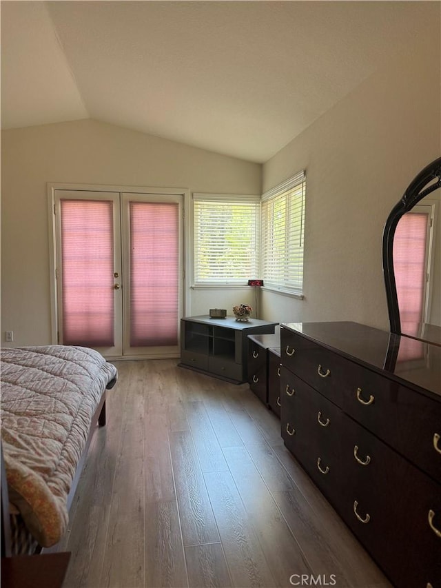 2801 Woodview Ct, Walnut, CA 91789 - bedroom with lofted ceiling, access to exterior, and wood finished floors