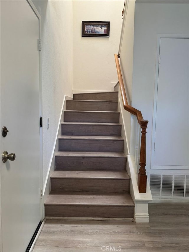 2801 Woodview Ct, Walnut, CA 91789 - staircase with wood finished floors