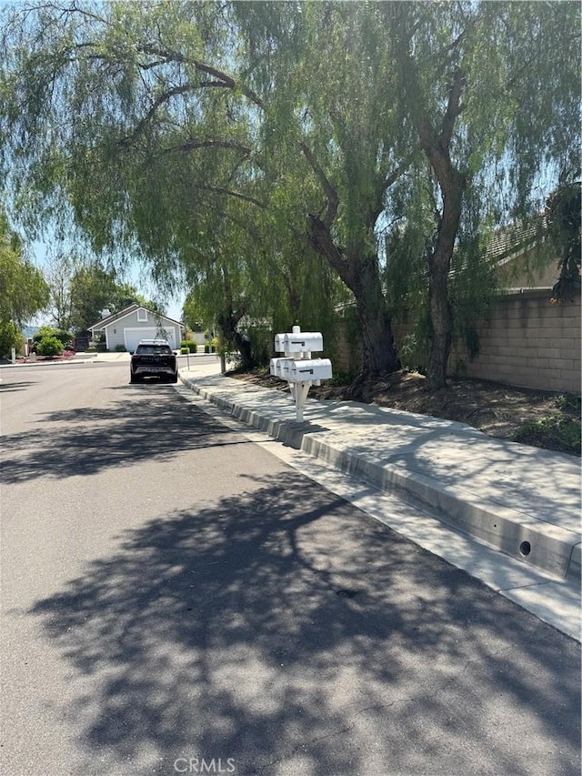2801 Woodview Ct, Walnut, CA 91789 - view of asphalt street with curbs and sidewalks