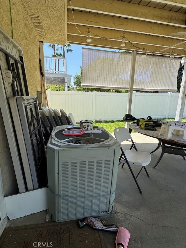 exterior view of central AC unit and fence