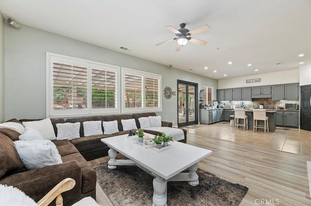 1232 Tucson Ave, Norco, CA 92860 - living area featuring healthy amount of natural light, ceiling fan, recessed lighting, and light wood-style flooring