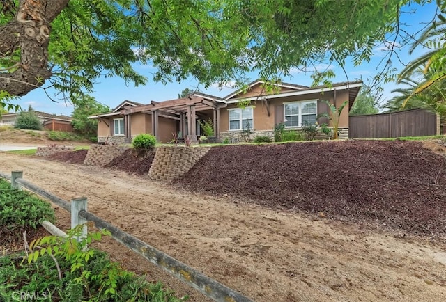 1232 Tucson Ave, Norco, CA 92860 - single story home with stucco siding, stone siding, a pergola, and fence
