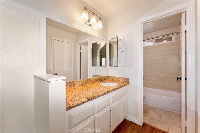 bathroom with vanity and shower / bathtub combination