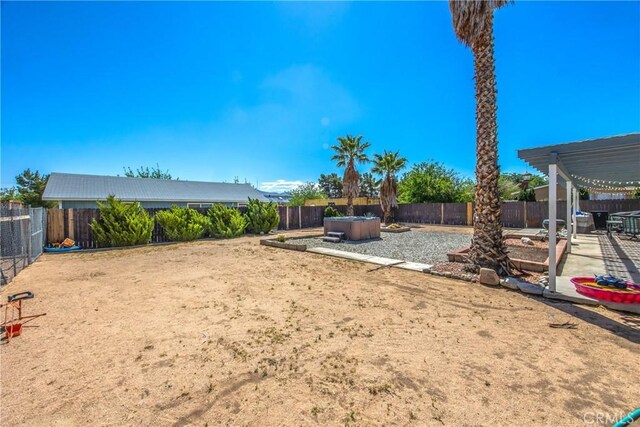 fenced backyard with a patio area