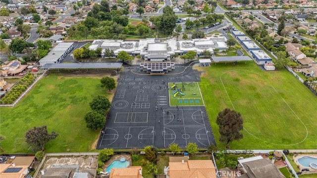 aerial view of residential area with a pool