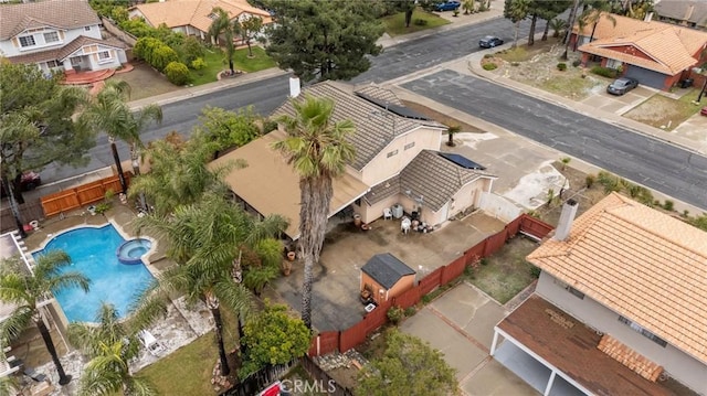 aerial view of residential area featuring a pool