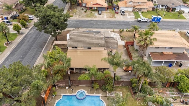 aerial view of property's location featuring nearby suburban area and a pool area