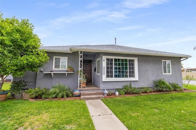 4034 Durfee Ave, Pico Rivera, CA 90660 - view of front of home featuring a front lawn and stucco siding