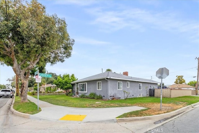 4034 Durfee Ave, Pico Rivera, CA 90660 - view of front of home with stucco siding and a chimney