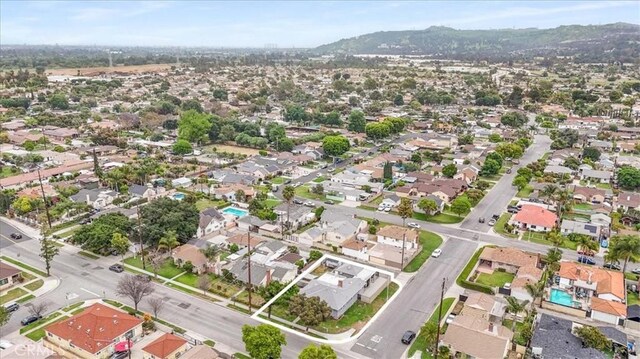 4034 Durfee Ave, Pico Rivera, CA 90660 - aerial perspective of suburban area with property boundaries highlighted and a mountainous background