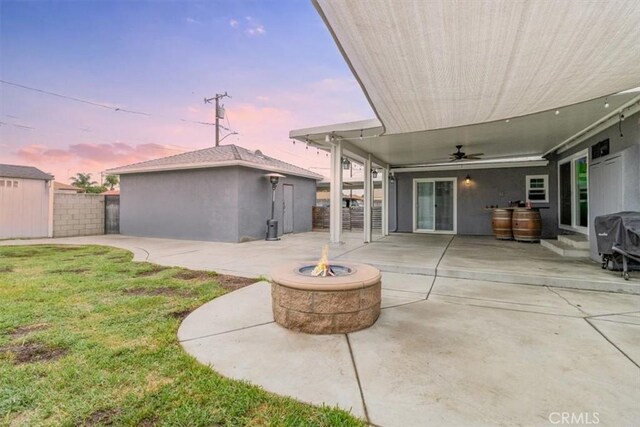 4034 Durfee Ave, Pico Rivera, CA 90660 - back of house with an outdoor fire pit, a patio area, a ceiling fan, and an outbuilding