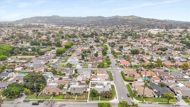 4034 Durfee Ave, Pico Rivera, CA 90660 - aerial overview of property's location featuring mountains and nearby suburban area