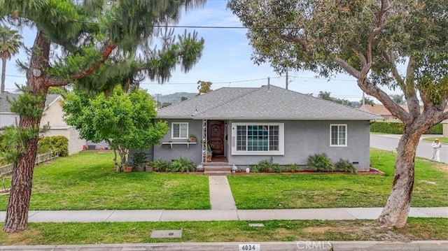 4034 Durfee Ave, Pico Rivera, CA 90660 - bungalow-style home featuring stucco siding, a front lawn, and roof with shingles