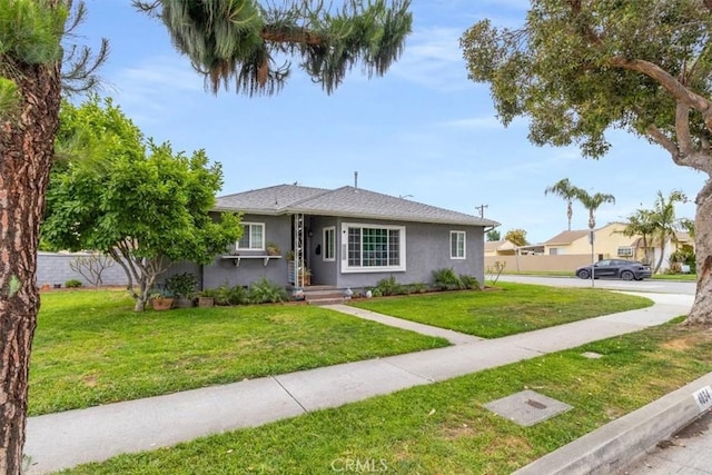 4034 Durfee Ave, Pico Rivera, CA 90660 - bungalow featuring stucco siding and a front lawn