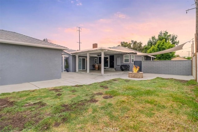 4034 Durfee Ave, Pico Rivera, CA 90660 - rear view of house featuring an outdoor fire pit, a patio, and stucco siding