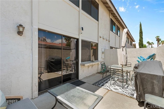 6134 Arroyo Rd Unit 3, Palm Springs, CA 92264 - view of patio featuring outdoor dining space and a grill