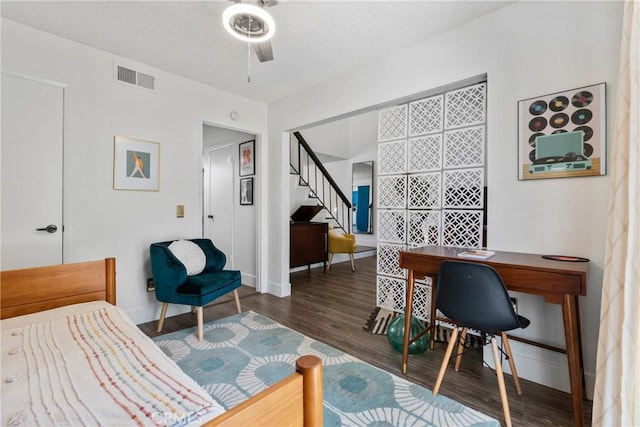 6134 Arroyo Rd Unit 3, Palm Springs, CA 92264 - bedroom with wood finished floors, an office area, baseboards, a textured ceiling, and ceiling fan