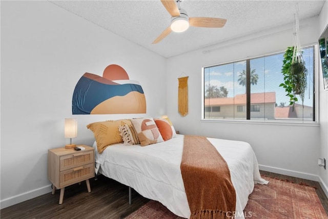 6134 Arroyo Rd Unit 3, Palm Springs, CA 92264 - bedroom featuring baseboards, a textured ceiling, wood finished floors, and a ceiling fan