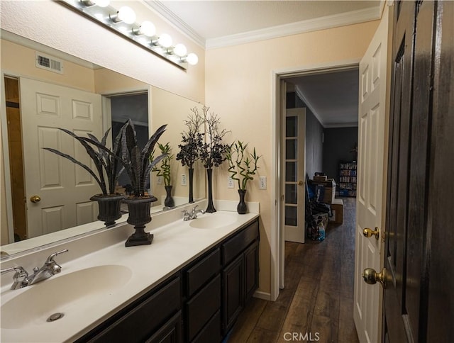 970 Riverview Cir, Corona, CA 92881 - bathroom featuring ornamental molding, hardwood / wood-style flooring, and double vanity