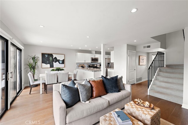 206 Avenida Adobe, San Clemente, CA 92672 - living room featuring stairs, recessed lighting, light wood finished floors, and baseboards