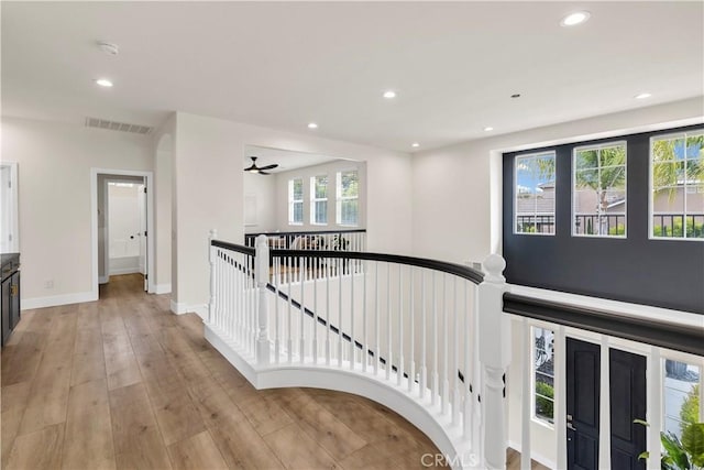 40225 Camino Campos Verde, Temecula, CA 92591 - stairs with recessed lighting, healthy amount of natural light, wood finished floors, and baseboards