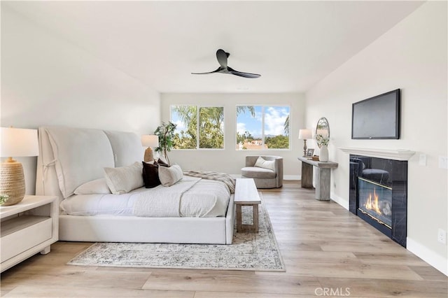 40225 Camino Campos Verde, Temecula, CA 92591 - bedroom with a tiled fireplace, wood finished floors, and baseboards