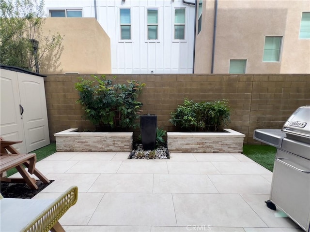 148 Spectacle, Irvine, CA 92618 - view of patio featuring a storage shed and a grill